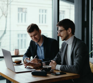 two young businessman having successful meeting restaurant 1