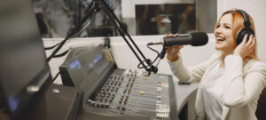 female host communicating microphone woman radio studio 1