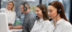 colleagues working together call center with headphones 1 1