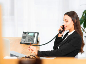 side view young woman holding pencil hand talking telephone 1