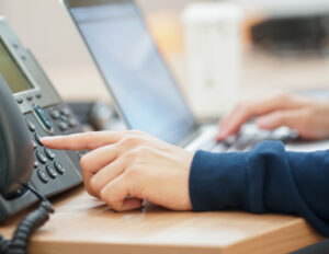 employee man hand press number telephone contact with someone 1 1