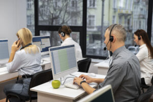 colleagues working together call center with headphones